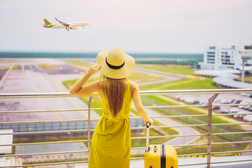 A traveler packing a bright suitcase surrounded by a passport, map, camera, and flight tickets, illustrating travel preparation and common mistakes to avoid.