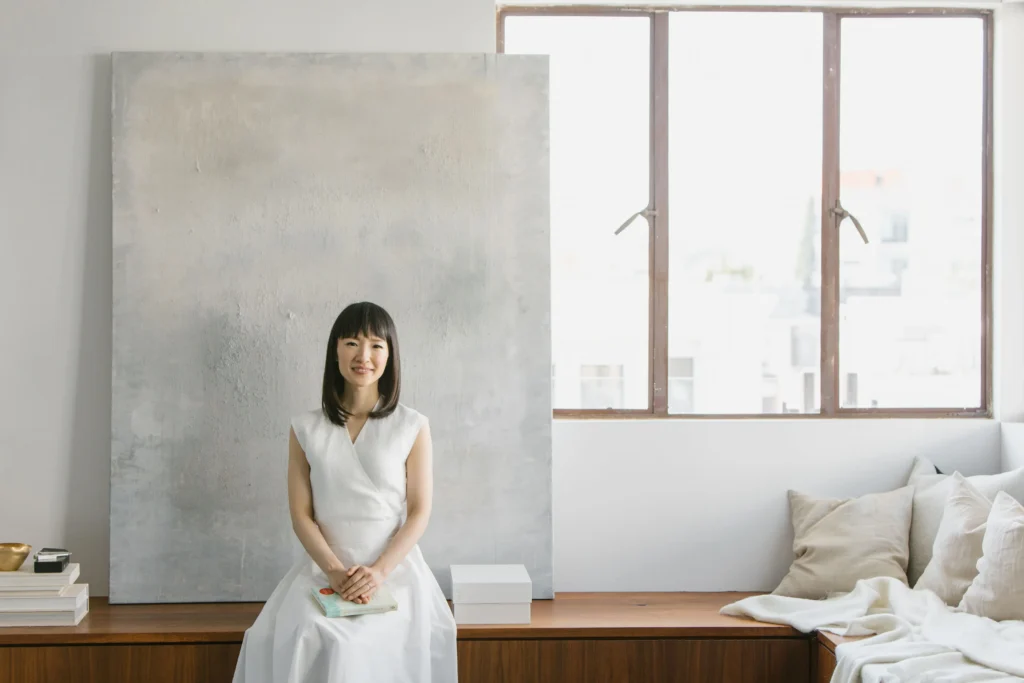 Marie Kondo smiling, featured as a top lifestyle influencer and organization expert.