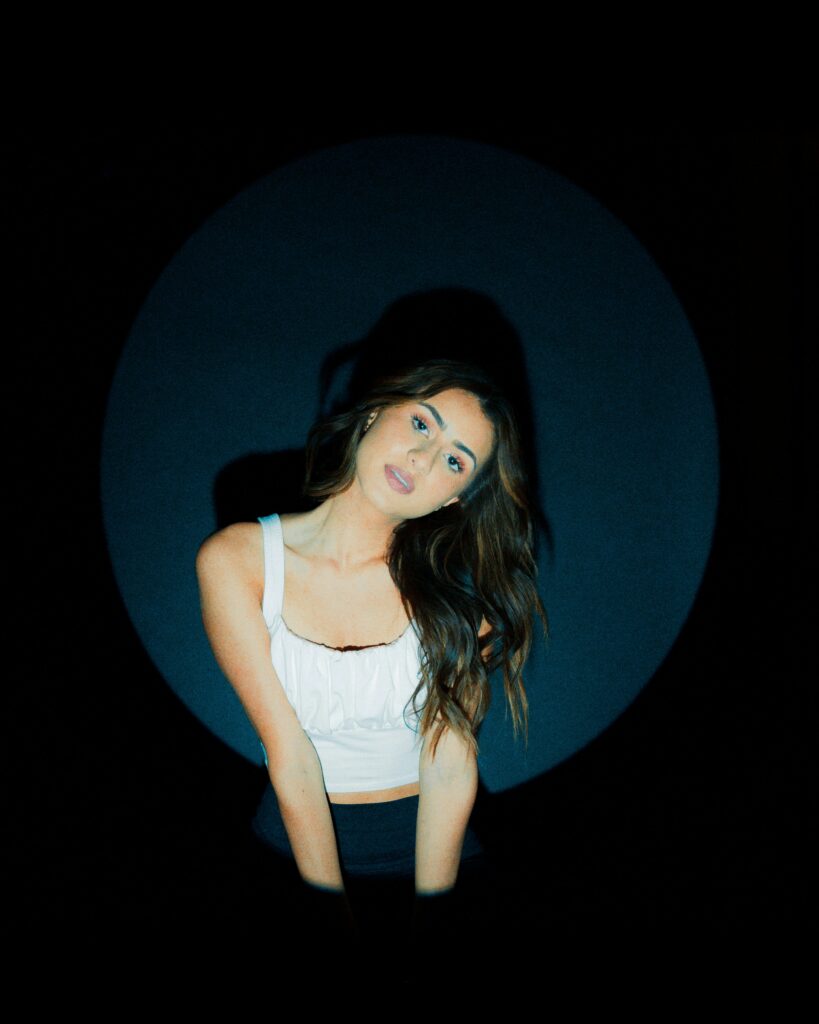 Michelle Phan posing in a modern setting, highlighted as a top lifestyle and beauty influencer in the USA.