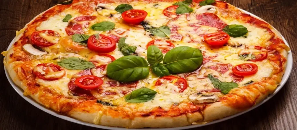 Freshly baked Margherita pizza topped with melted mozzarella cheese, vibrant red tomato sauce, and fresh basil leaves on a rustic wooden peel
